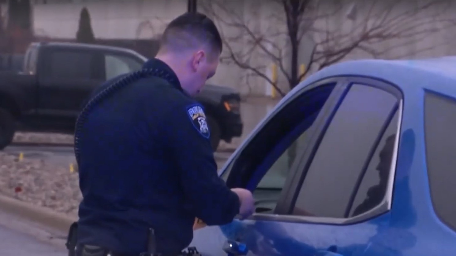 Officer next to vehicle